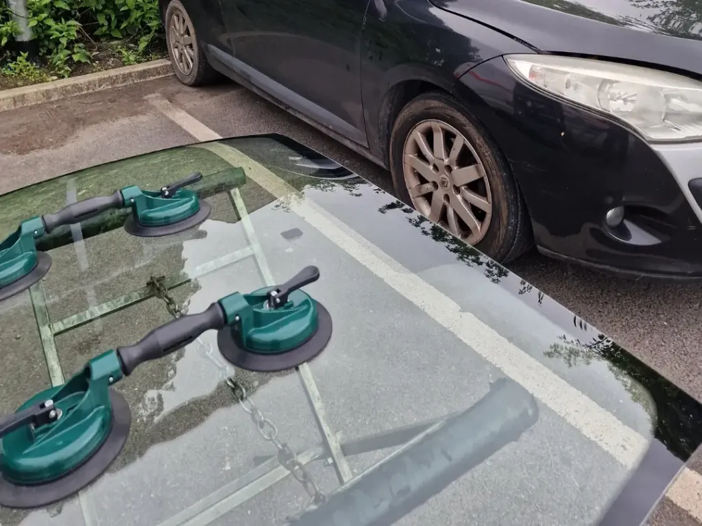 A newly fitted windscreen with retention tape applied around the edges